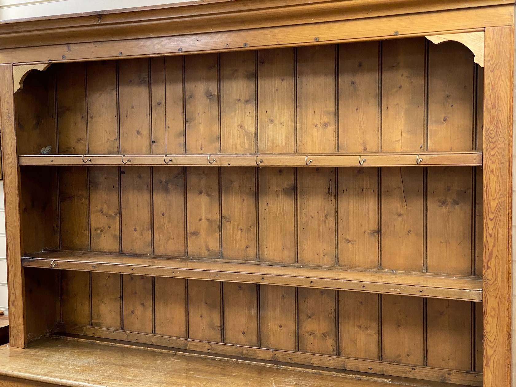A Victorian pine dresser with boarded rack, length 182cm, depth 46cm, height 223cm
